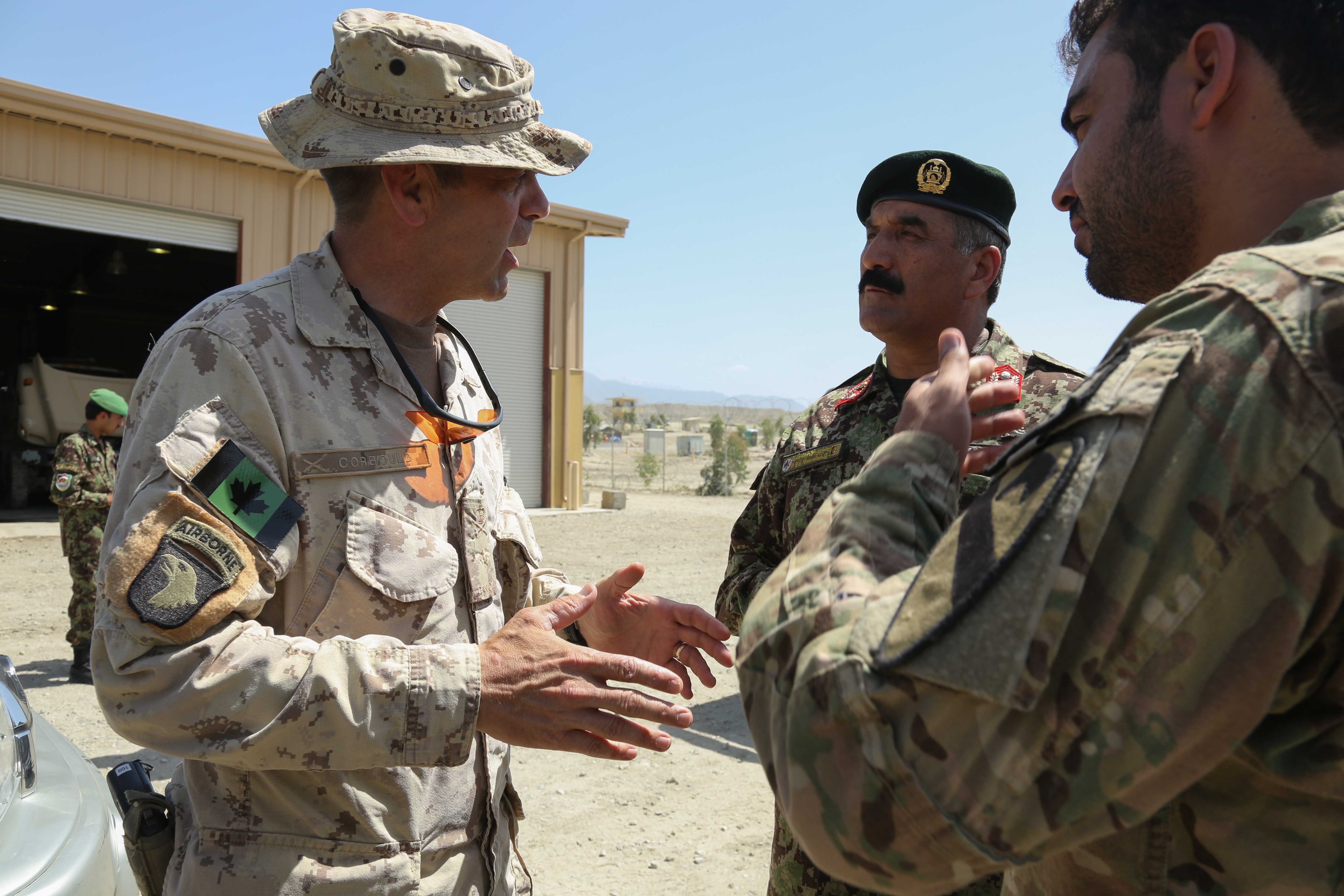https://upload.wikimedia.org/wikipedia/commons/3/35/Canadian_Army_Brig._Gen._Dave_Corbould,_center_left,_the_deputy_commanding_general_of_Coalition_Effects_and_Transitions,_Combined_Joint_Task_Force_101,_Regional_Command_East,_talks_with_an_Afghan_National_Army_130523-A-XM609-063.jpg